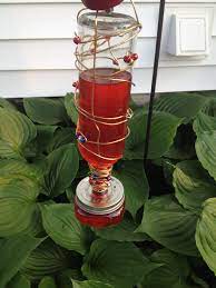 Diy Hummingbird Feeder So Easy To Do All You Need Is A Wine Bottle Wire Mini Mason Jar And Some Diy Hummingbird Feeder Humming Bird Feeders Diy Bird Feeder