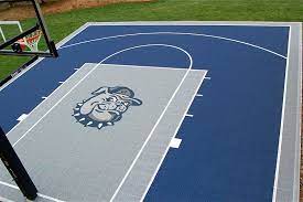 Is wood really the best flooring for a basketball court? 32x34 Basketball Court Complete With Logo Show Off Your Colours While Showing Off Your Basketball Court Backyard Backyard Basketball Outdoor Basketball Court