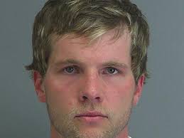 Roebuck man charged with shoplifting, carrying concealed weapon