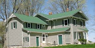 New luxury home with elegant touches including covered entrance, columns. 16 Siding Ideas Green Roof House House Colors House Exterior