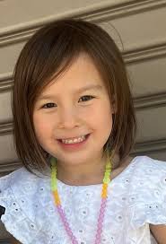 Young Girl Climbs Rope in Gym Class