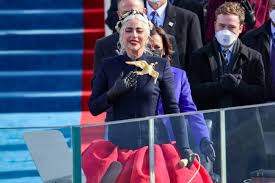 Lady gaga is wearing the mockingjay pin to symbolize the commencement of our own hunger games. Lady Gaga Surprises Fans In A Hunger Games Esque Dress At Joe Biden S Inauguration Hello