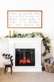 Check out this fantastic rustic master bedroom above featuring a large wood burning fireplace with natural brown real stone veneer and cast surround with matching mantle. 18 Cozy Electric Fireplaces That Look Like The Real Thing Making Lemonade