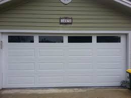 amarr long panel garage door with solid windows gives this home in jacksonville a more modern look garage door windows garage door panels garage door springs