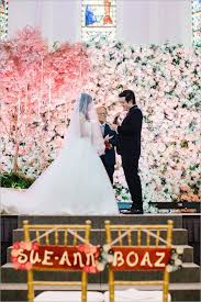 Socially Conscious Wedding With A Standout Flower Wall Boaz And Sue Ann Flower Wall Wedding Wedding Quirky Bride