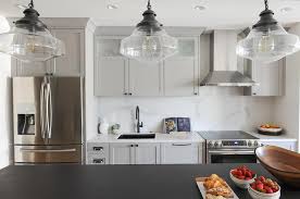 A transitional style kitchen in wellington, florida features a beautiful contrast of light cabinets with a dark island. Gray Kitchen Cabinets Selection You Will Love 2020 Updated