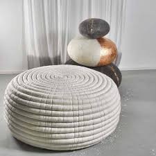 If you have little ones, consider skipping the sharp corners of a coffee table and try a group of poufs instead. Ndebele An Ottoman Or Coffee Table In Merino Wool Handmade Ronel Jordaan