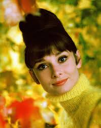 Lovely Audrey Hepburn wearing yellow Balmain tricot sweater. A still from  Ladies` Home Journal, 1963. By Howell Conant.