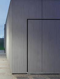 Garagedoor And Facade Seamless Integration Clad With Equitone Facade Panels Equitone Com Fibre Cement Roof Cladding Fibre Cement Cladding Y Exterior Wal