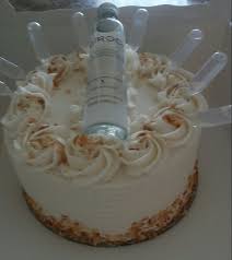Have Your Cake And Drink It Too Coconut Flavored Cake With Buttercream Icing And Toasted Coconut Topped With A Min Alcohol Cake Liquor Cake Liquor Bottle Cake