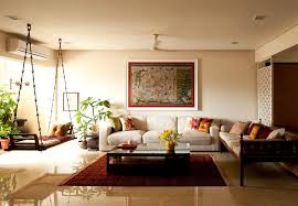 The colorful abstract painting on colored wall reminds us of the festival of color. Indian Style Home Interior Designs
