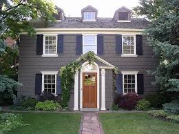 Black And White House With Wood Door Jenny Castle Design Exterior House Love Colonial House Exteriors Gray House Exterior House Paint Exterior