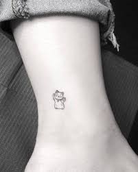They have a distinct and unmistakable look, making them perhaps the most easily recognizable tattoos around the world. Tattoo Tagged With Small Micro Line Art Animal Japanese Culture Tiny Maneki Neko Ankle Ifttt Little Evankim Cat Illustrative Fine Line Feline Patriotic Inked App Com