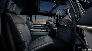 Described when it was introduced as a station wagon body style, the pioneering design became known in time as a sport utility vehicle (suv). 2022 Jeep Grand Wagoneer Interior Rear Seats Caricos