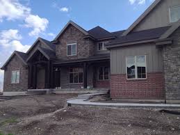 Brick Homes With Stone Accents Using Brick Stone On Your Home Exterior Red Brick House Exterior Bay Window Exterior Exterior Stone
