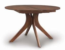 Lacquered, solid wood, glass or ceramic stone top. Audrey Round Extension Trestle Table