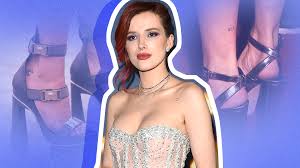 Bella thorne has revealed a pair of brand new tattoos on her body in a series of racy instagram bella thorne shows off one of two tatts she's just had inked on her back. Bella Thorne S Tattoos Secret Meanings Photos Stylecaster