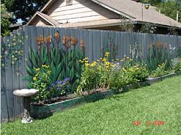 Follow our steps to fix, clean, repaint your fence and add some greenery for the best effect. Fence Art 25 Pieces Of Art Using A Backyard Fence As The Canvas 100 Things 2 Do Garden Fence Art Garden Mural Backyard Fences