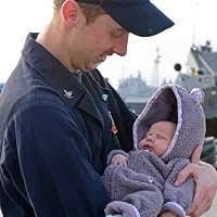U.S. Coast Guard Capt. David Cinalli (right) makes