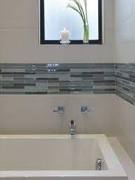 Listello border tile is a group of tiles that stretches across a wall or floor with a pattern that contrasts the other tile that it is built with. Tub Surround With Glass Tile Accent Idee Salle De Bain Deco Salle De Bain Amenagement Salle De Bain