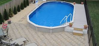 A 15′ x 30′ oval 52″ deep ohana above ground pool kit is the ultimate in steel pools! Above Ground Pool Deck Landscaping Ideas Backyard Pool