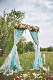 Maybe you would like to learn more about one of these? Beautiful White Wedding Arch Decorated With Purple And White Flowers Outdoors Near The Willow Tree Stock Photo Picture And Royalty Free Image Image 55537198
