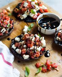 In a small bowl, stir together the oil, garlic, salt, and pepper and brush generously on the mushroom caps. Grilled Portobello Mushrooms With Caprese Salad Little Broken