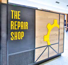 The Logo Of The Repair Shop Kiosk Interior Design By Oro Design Sydney Orodesignstudio Design Style Store T Shop Signage Shop Front Signage Mobile Kiosk