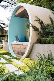 This Award Winning Garden Design Uses Concrete Pipes To Create Seating A Water Feature And A Fire Pit Urban Garden Design Modern Garden Garden Design