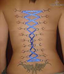 What Do Bow Tattoos On Back Of Legs Mean Tattoosonback Corset Piercings Back Tattoo Neck Tattoo
