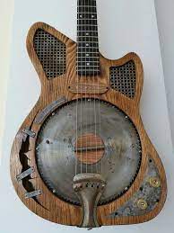 Pin By Zack Burke On Lo Fi Cool Box Guitar Guitar Gadgets Steampunk Guitar