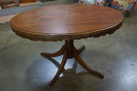 Nicely carved legs with brass loins paw feet. Oval Duncan Phyfe Coffee Table