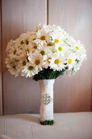 White daisies and yellow daisies are a great gift to a celebrate a special occasion with a unique daisy bouquet! Diy Daisy Wedding Arrangements Doing The Daisy Thing Blooms By The Box