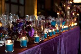 The Tables Were All Purple With Teal Votives Along With Gold Trees Embellished With Crystals Purple Wedding Theme Wedding Colors Purple Purple And Gold Wedding