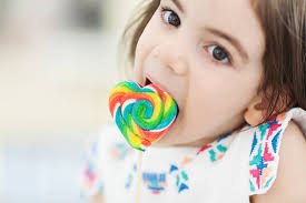 30+ Little Blonde Girl Licking A Colorful Lollipop Stock Photos, Pictures &  Royalty-Free Images