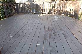 this deck has a dark old solid stain on it solid stains last the longest usually but are hardest to remove when it s time deck deck cleaner staining deck