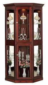 A corner curio cabinet from bed bath & beyond is a great option to consider and will mix well with most decor. Large Corner Curio Cabinet From Dutchcrafters Amish Furniture