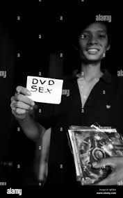 man in patpong selling sex films on dvd , patpong , silom road , bangkok ,  thailand Stock Photo - Alamy
