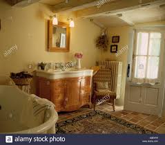 pine mirror above large porcelain basin