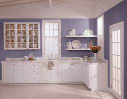 Though this kitchen's range and cabinets are both white, one has brass. Here S My Purple Kitchen Purple Kitchen Walls Purple Kitchen Kitchen Cabinets