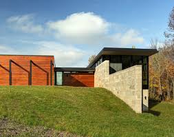 The interior space of the three bedroom, 2.5 bath home is divided into three distinct zones: Fieldstone House By Bruns Architecture
