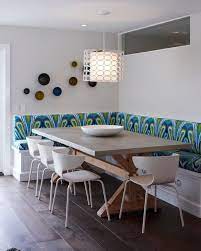 Though Defined By Clean White Walls And Hardwood Floors This Single Family Home Comes To Life With Bright M Dining Booth Eclectic Dining Room Banquette Dining