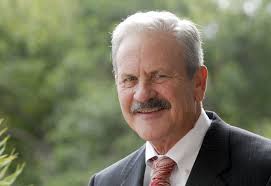 Archive photos of Health First co-founder Larry Garrison