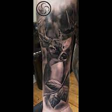 awesome deer tattoo by stefan realistic tattoo deer venison nature forest leaves city tattoo deer tattoo tattoos
