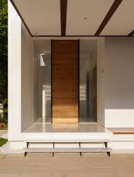 Interior Minimalist Contemporary Home Interior Design With Courtyard Wooden Door Between Glass Window Modern Entrance Door Front Door Design Door Design