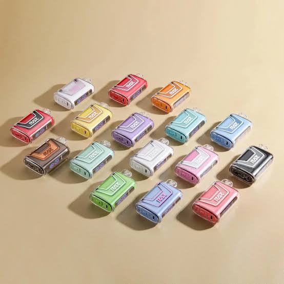 Multiple colorful Raz disposable vape devices lined up in rows on a beige surface VapeFeat product guide