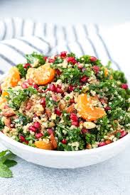 A filling and flavorful salad you will most certainly love! Kale Quinoa Pomegranate Salad The Saucy Fig