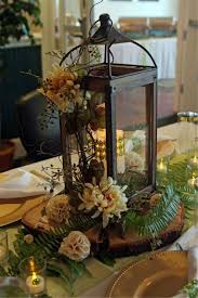 31 Gorgeous Winter Lantern Centerpieces Ideas Best For Dining Room Decor In 2020 Lantern Centerpiece Wedding Table Flower Arrangements Wedding Decorations Centerpieces