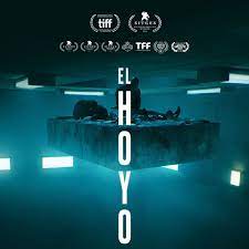 The inmates above eat heartily, leaving those below starving and desperate. El Hoyo Entre La Metafora Y El Autorretrato