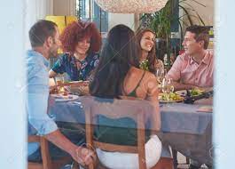 The dinner party profile and history. Friends Enjoying Each Others Company At A Dinner Party Gathering In A Warm Cosy Home House Stock Photo Picture And Royalty Free Image Image 73770475